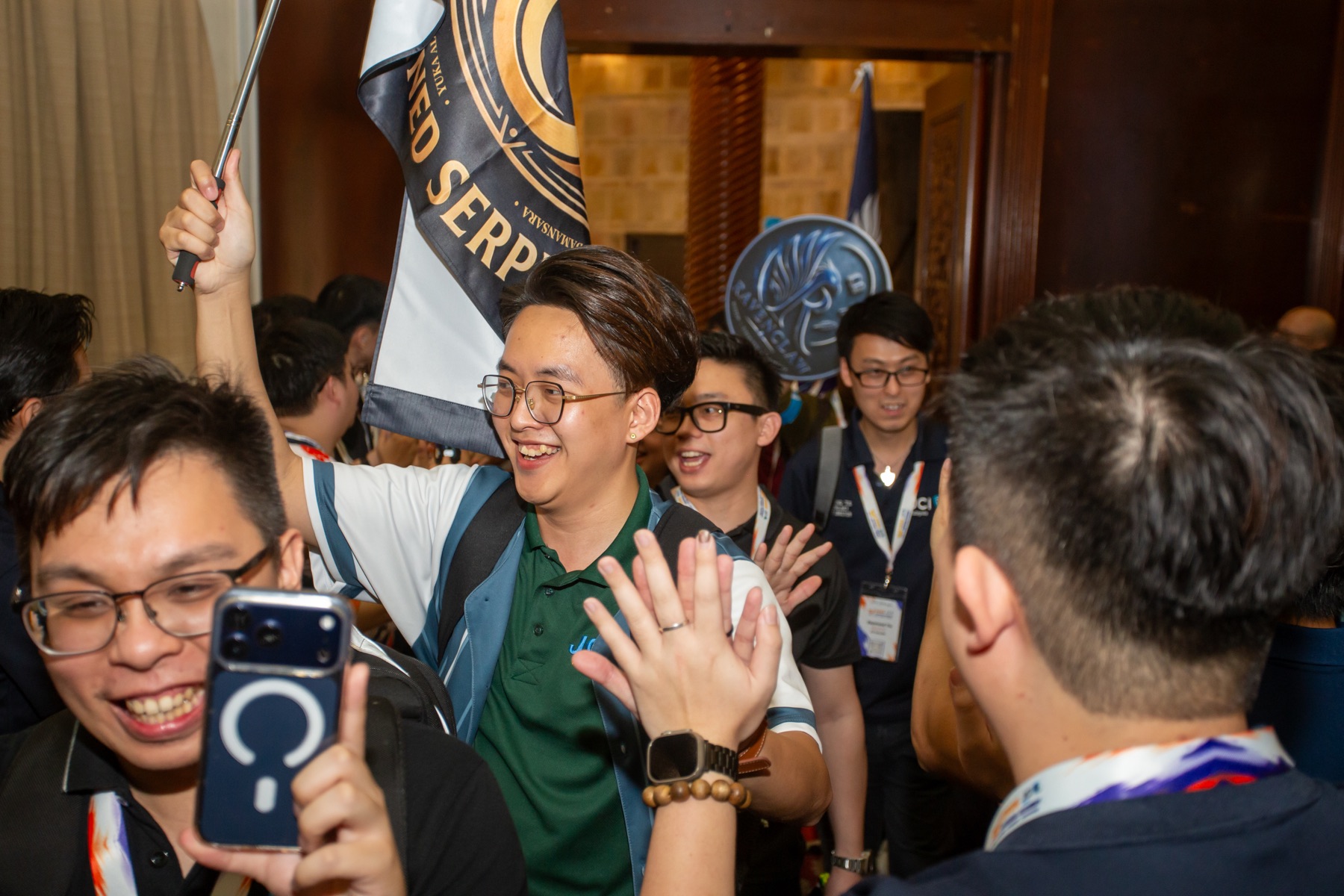 An Academian carrying a house flag during the welcome
