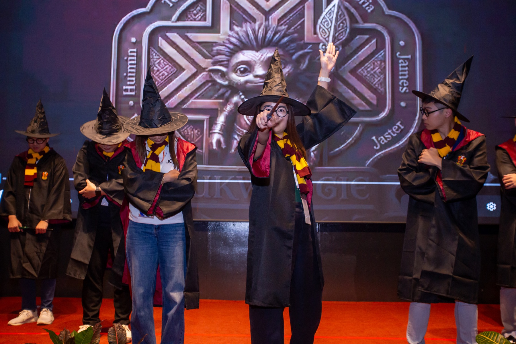 Academians performing in magical robes and hats