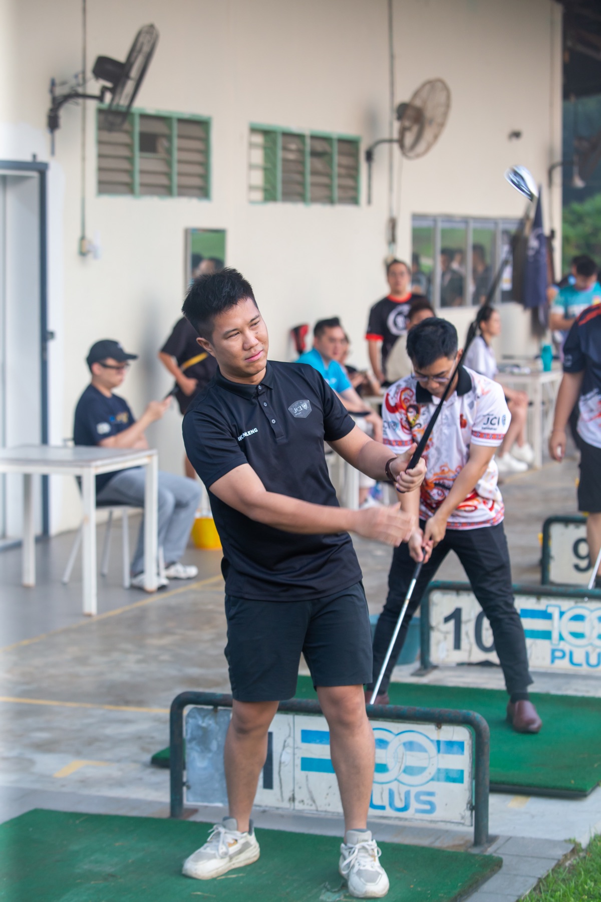 An Academian practising a golf swing
