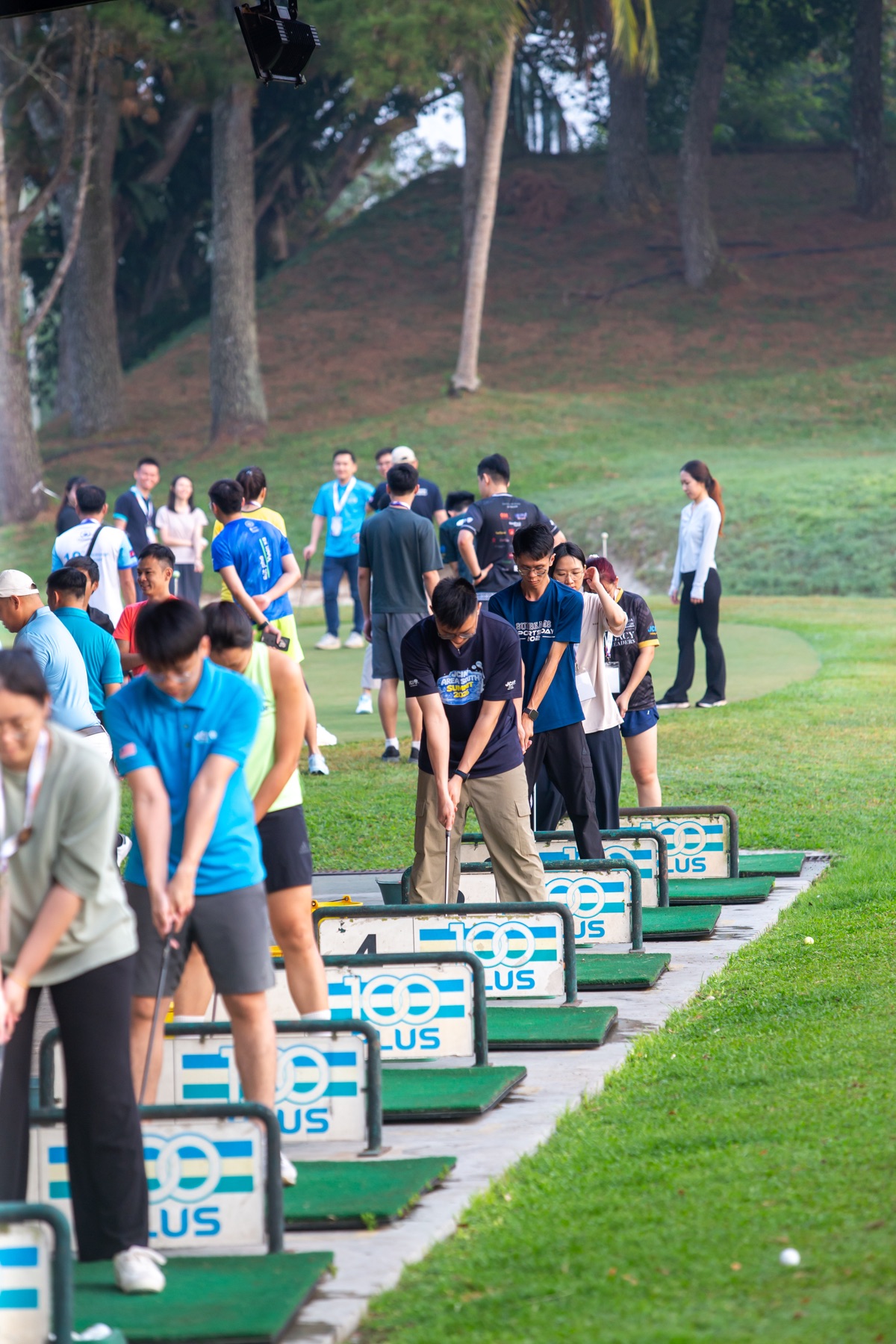 Academians lining up at the driving range