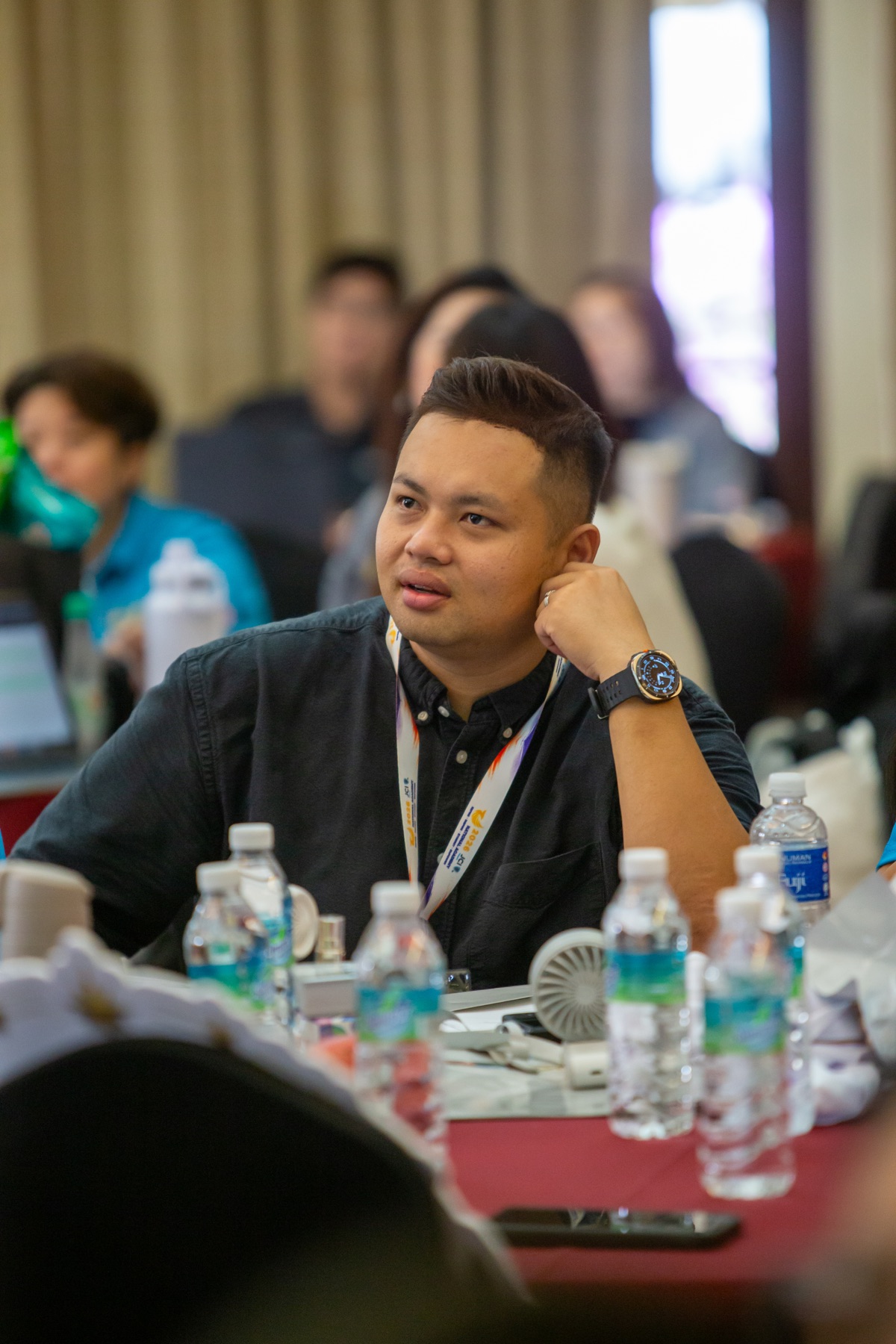 An Academian listening attentively during a module