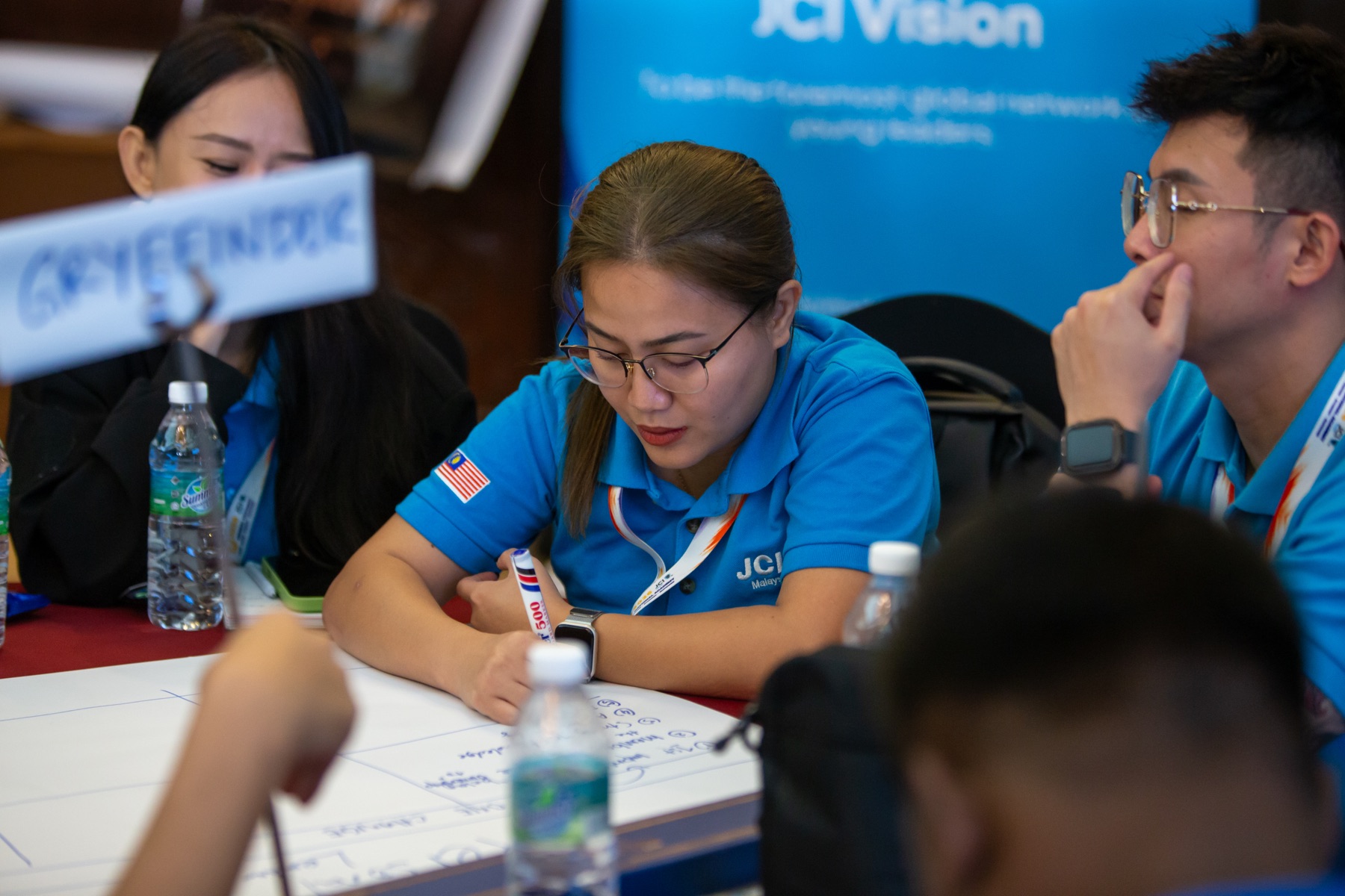 Academians developing ideas together at their table