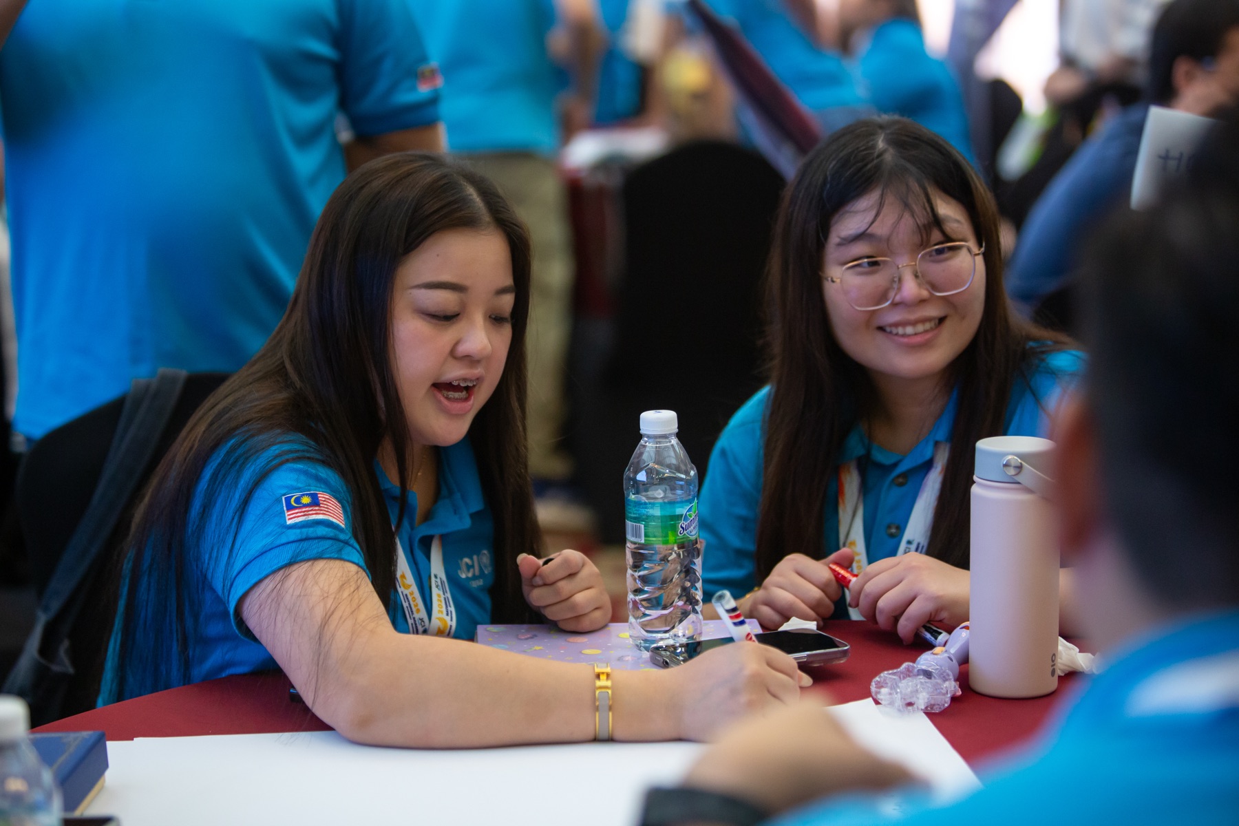 Academians smiling during a group discussion