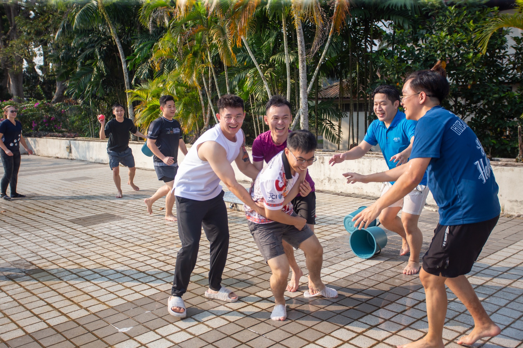 Academians laughing together during an outdoor challenge
