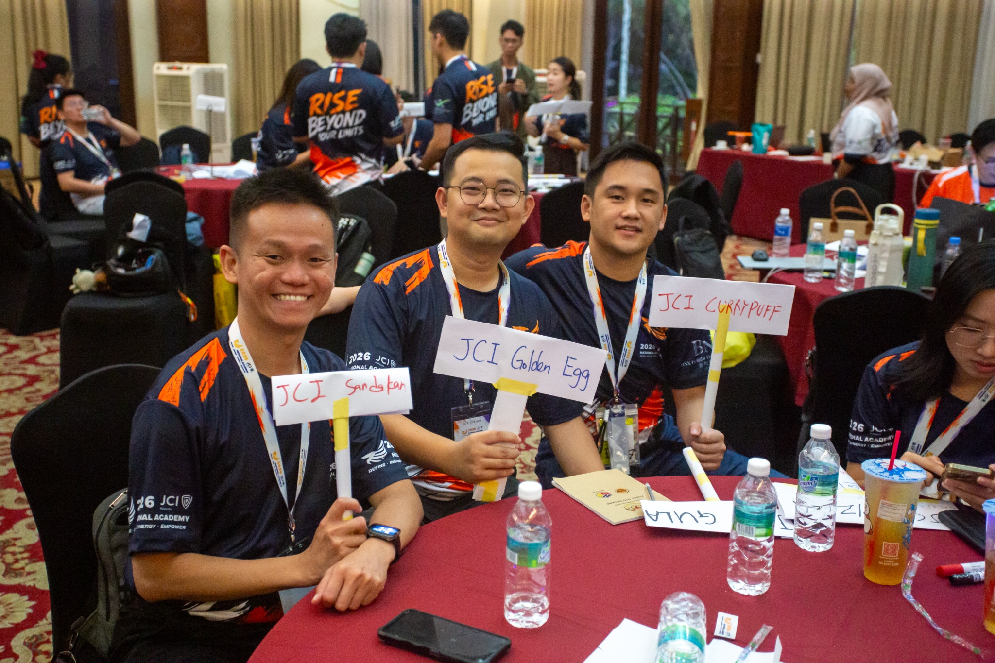 Participants with creative team signs