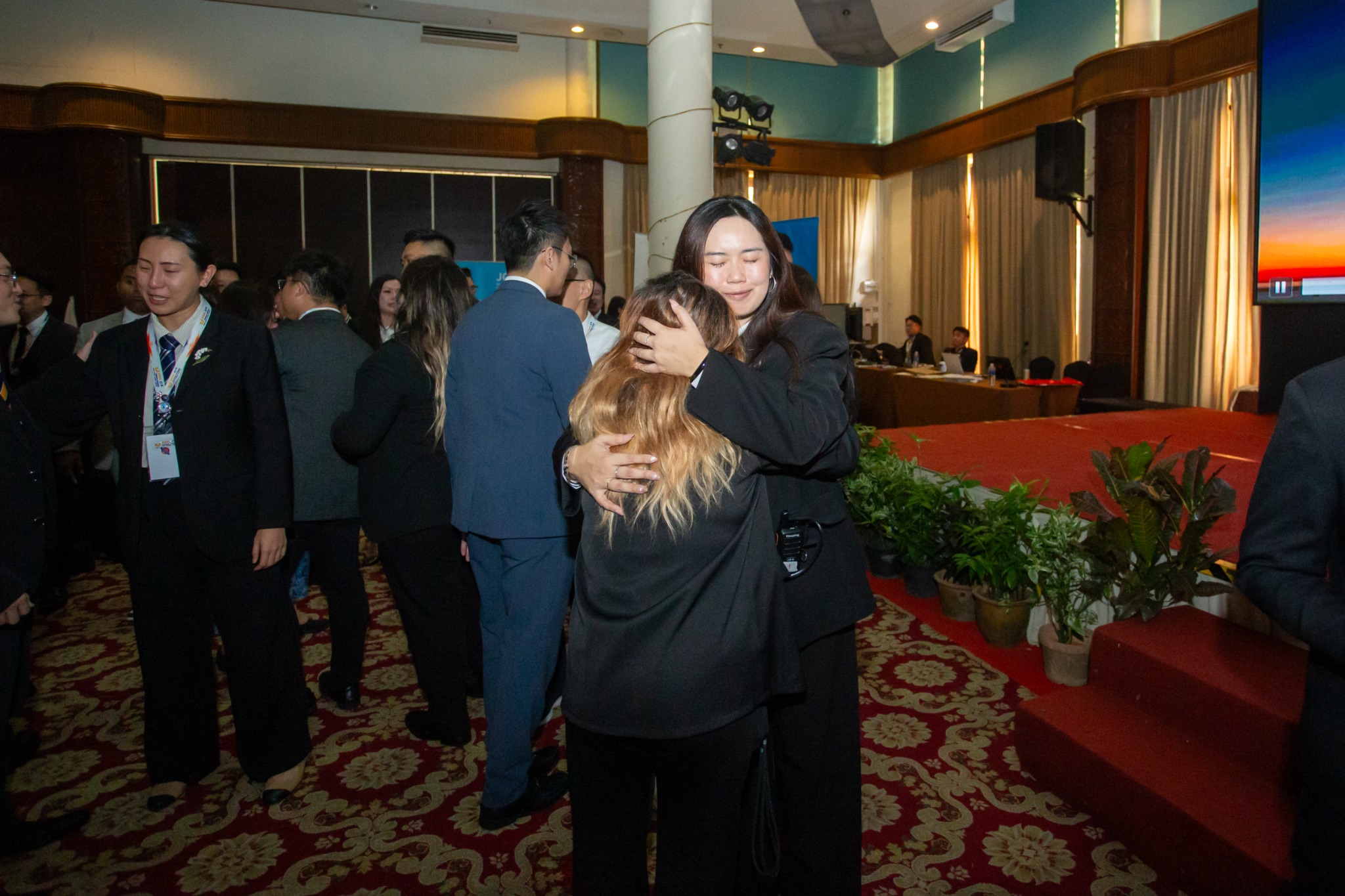 Participants sharing a hug